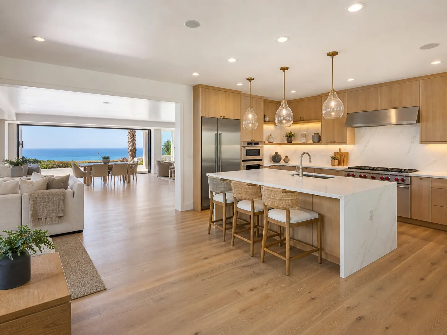 Open-concept kitchen remodel in La Jolla featuring custom cabinetry and structural wall removal by Pacific Edge Renovation.